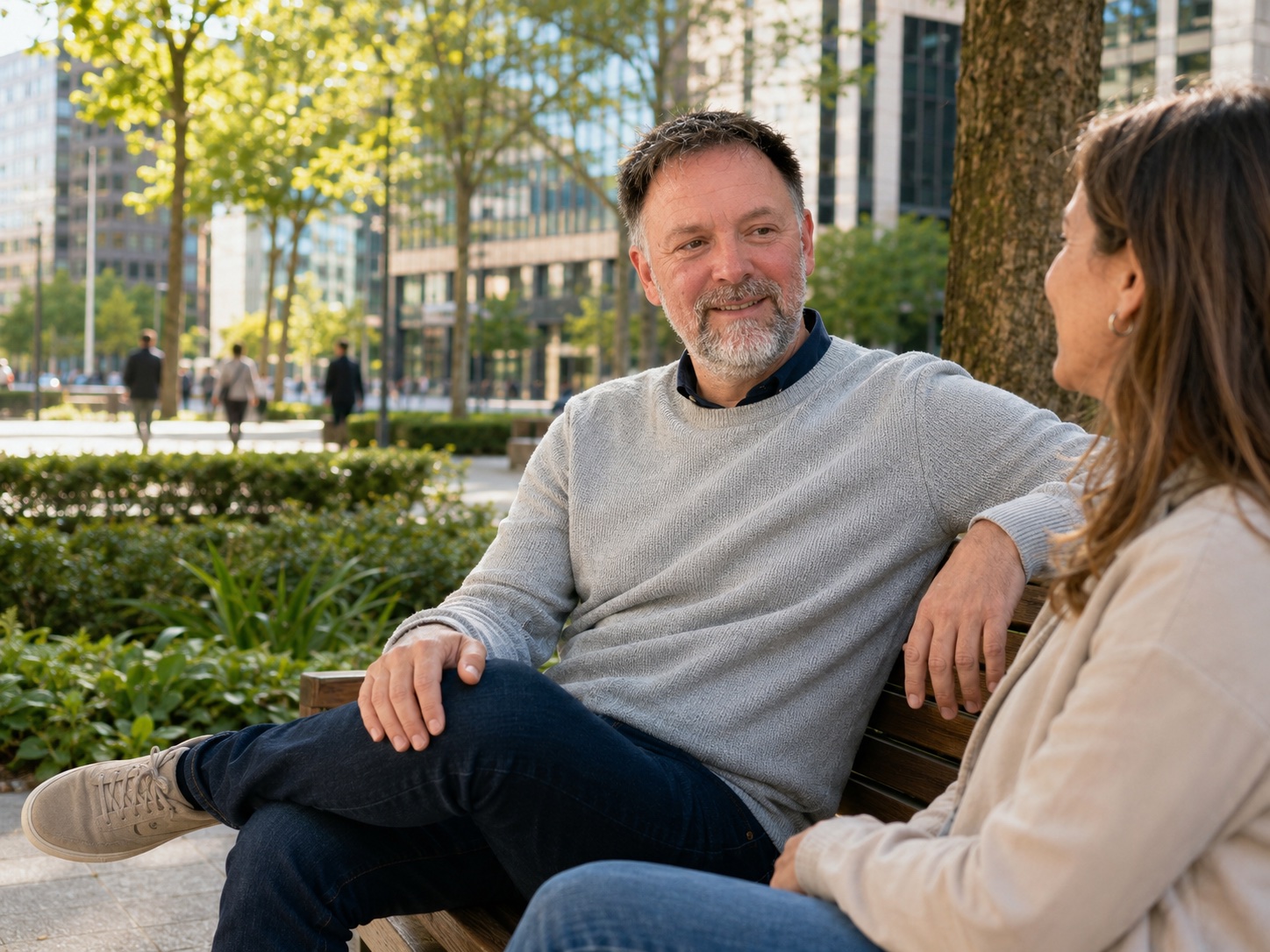 Lars Köhler speaking with a business owner outdoors